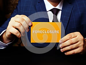 Financial concept about FORECLOSURE with inscription on the page. Lender attempts to recover the amount owed on a defaulted loan