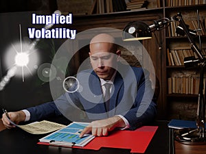 Financial concept about Implied Volatility . Closeup portrait of unrecognizable successful businessman wearing formal suit reading