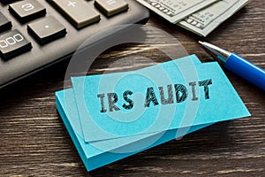Financial concept about IRS AUDIT Internal Revenue Service with sign on the sheet photo