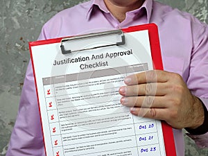 Financial concept about Justification And Approval Checklist with phrase on the sheet