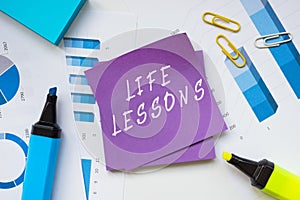 Financial concept about LIFE LESSONS with sign on the page