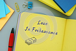 Financial concept about Loan In Forbearance with inscription on the sheet