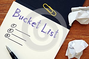 Financial concept meaning Bucket List with phrase on the piece of paper