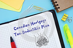 Financial concept meaning Canadian Mortgage Tax-Deductible Plan with sign on the sheet