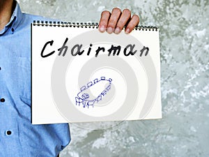 Financial concept meaning Chairman with sign on the piece of paper