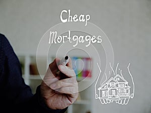 Financial concept meaning Cheap Mortgages with inscription on the piece of paper