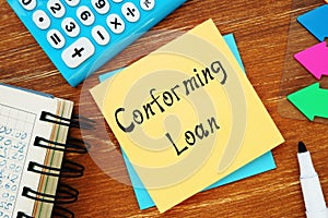 Financial concept meaning Conforming Loan with inscription on the sheet photo