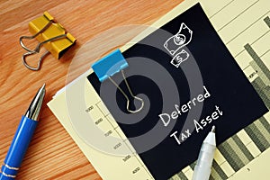 Financial concept meaning Deferred Tax Asset with phrase on the piece of paper