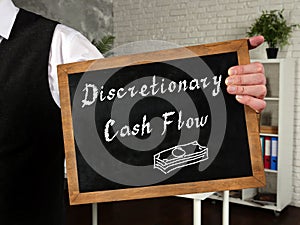 Financial concept meaning Discretionary Cash Flow with inscription on the piece of paper