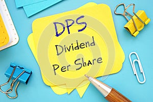 Financial concept meaning Dividend Per Share DPS with sign on the piece of paper photo