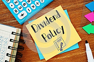 Financial concept meaning Dividend Policy with inscription on the sheet