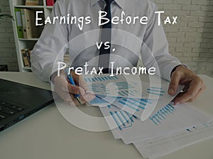 Financial concept meaning Earnings Before Tax vs. Pretax Income with sign on the sheet