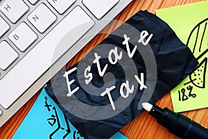 Financial concept meaning Estate Tax with inscription on the sheet