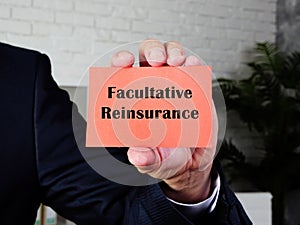 Financial concept meaning Facultative Reinsurance with sign on the sheet