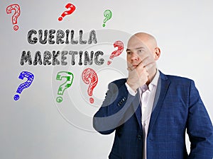 Financial concept meaning GUERILLA MARKETING question marks with inscription on the side