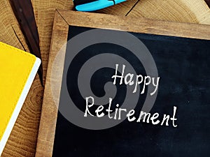 Financial concept meaning Happy Retirement with phrase on the piece of paper