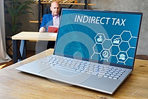 Financial concept meaning INDIRECT TAX with inscription on the computer