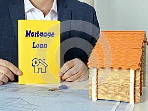 Financial concept meaning Mortgage Loan with sign on yellow book