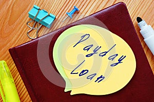 Financial concept meaning Payday Loan with inscription on the piece of paper