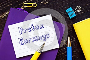 Financial concept meaning Pretax Earnings with inscription on the page