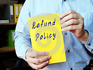 Financial concept meaning Refund Policy with sign on the piece of paper