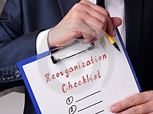 Financial concept meaning Reorganization Checklist with inscription on the page photo