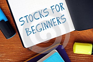 Financial concept meaning STOCKS FOR BEGINNERS exclamation marks with inscription on the piece of paper