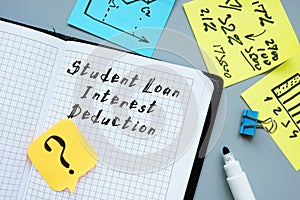 Financial concept meaning Student Loan Interest Deduction with sign on the sheet