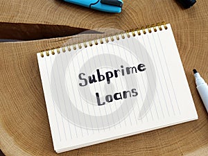 Financial concept meaning Subprime Loans with sign on the page photo