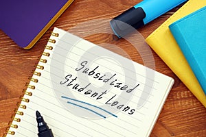 Financial concept meaning Subsidized Student Loans with inscription on the sheet