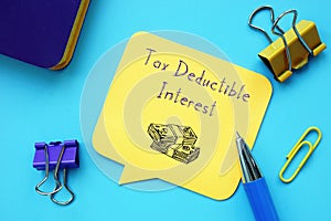 Financial concept meaning Tax Deductible Interest with phrase on the sheet