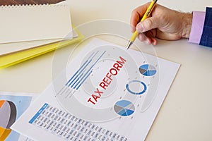 Financial concept meaning TAX REFORM with sign on the page