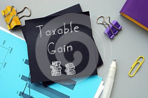 Financial concept meaning Taxable Gain with sign on the page photo
