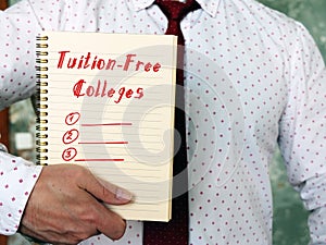 Financial concept meaning Tuition-Free Colleges with inscription on the sheet