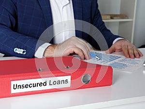 Financial concept meaning Unsecured Loans with phrase on the dossier