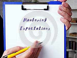 Financial concept about Mentoring Expectations with phrase on the sheet