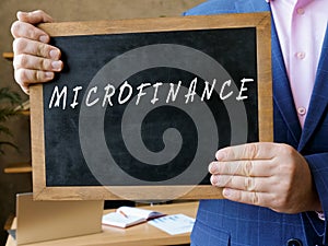 Financial concept about MICROFINANCE with inscription on the board photo