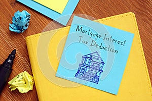 Financial concept about Mortgage Interest Tax Deduction with sign on the piece of paper