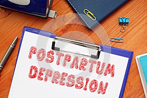 Financial concept about POSTPARTUM DEPRESSION with inscription on the page