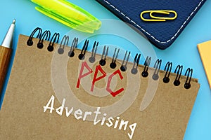 Financial concept about PPC Advertising with phrase on the sheet