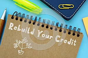 Financial concept about Rebuild Your Credit with sign on the piece of paper