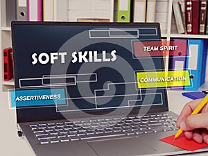 Financial concept about  soft skills team spirit communication assertiveness with sign on the piece of paper