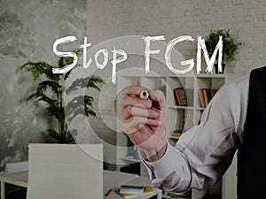Financial concept about Stop FGM Female Genital Mutilation with inscription on the piece of paper