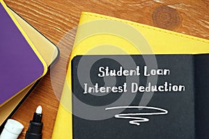 Financial concept about Student Loan Interest Deduction with phrase on the sheet