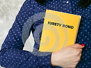 Financial concept about SURETY BOND with sign on the piece of paper