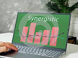 Financial concept about Synergistic with inscription on the page