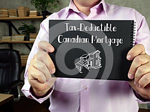 Financial concept about Tax-Deductible Canadian Mortgage with inscription on the sheet