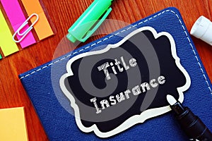 Financial concept about Title Insurance with phrase on the piece of paper