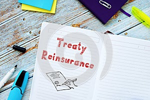 Financial concept about Treaty Reinsurance with inscription on the piece of paper