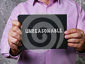 Financial concept about UNREASONABLE with phrase on the page